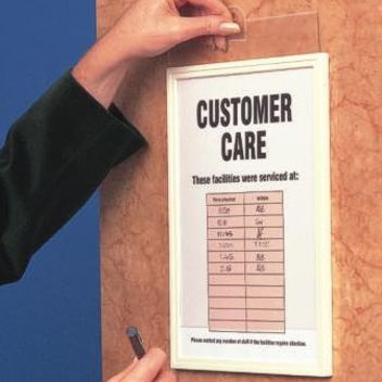 Stick-on frame with slide-in opening for notices