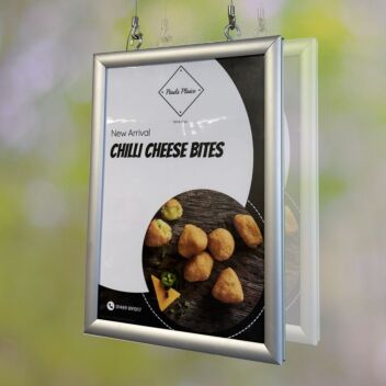 Dislaying posters in a shop window with suspended double-sided frames