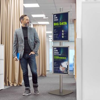 Poster stand with two frames advertising a conference in a hotel