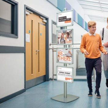 Tall poster stand with four A3 frames advertising a college open day event