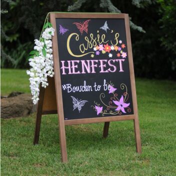 Light-weight wooden sandwich board advertising a hen-do