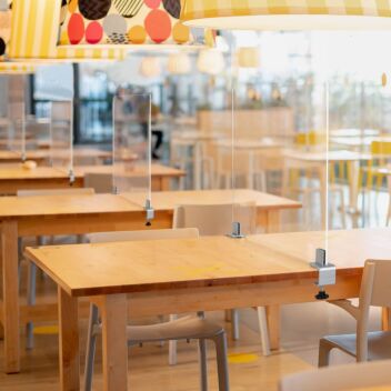 Table divider panels secured with Midway clamps