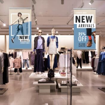 In-store display using poster hangers to catch attention