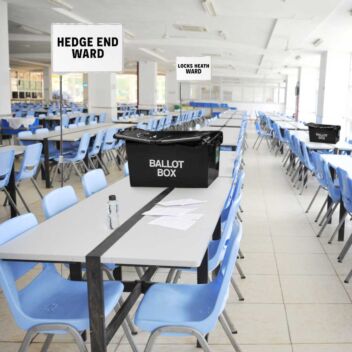 Ward signs displayed in a vote counting hall