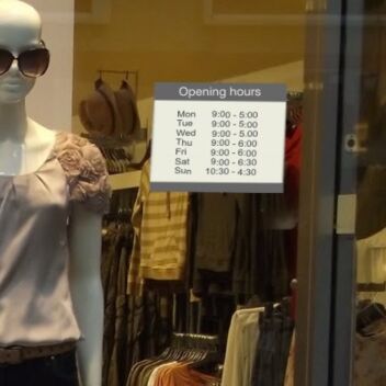 Opening hours sign holder - sticks to glass